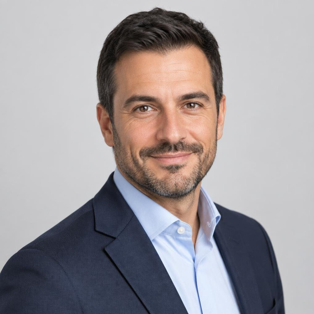 Studio portrait of a Swiss Italian man in his 40s, business editor